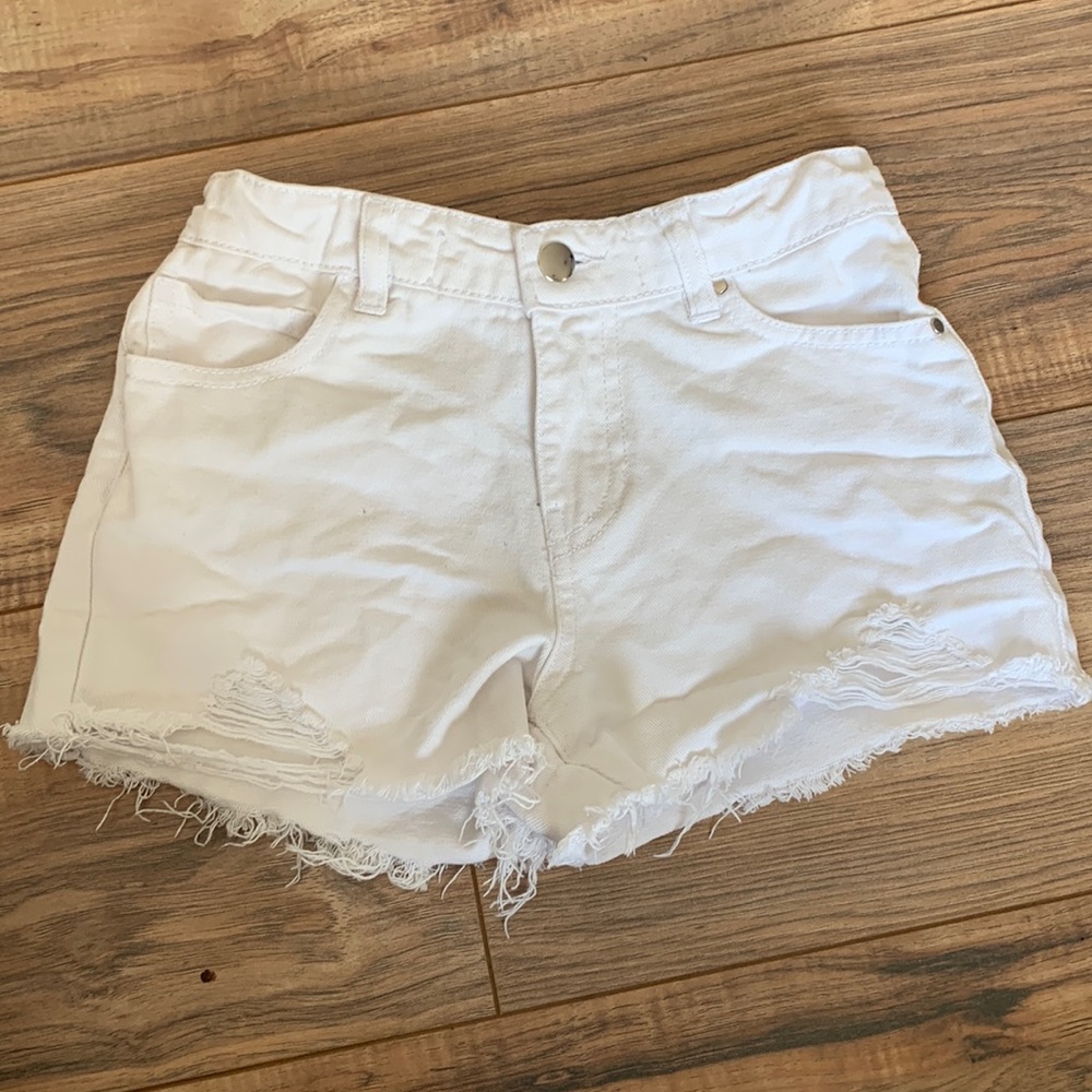 White ripped jean shorts
